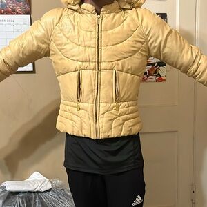 Fashionable girl’s puffer coat in gold with detachable hood